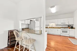 109 Oakleaf Drive, Pine Knoll Shores, NC 28512 – photo 18: Kitchen from Dining