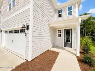 8635 Blue Haw Way Lot 130, Leland, NC 28451 — 5-bedroom home in Indigo Preserve, Leland, NC, photo 2 of 33: Front Porch