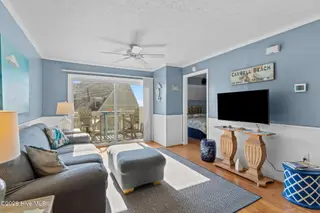 1000 Caswell Beach Road Apt. 806, Oak Island, NC 28465 — 2-bedroom condo in Oak Island Bch Villa, Oak Island, NC, photo 19 of 56: Sliding glass doors to balcony