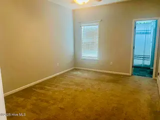 702 Pirates Landing Drive, Beaufort, NC 28516 – photo 22: Spacious Primary Bedroom w/ En Suite