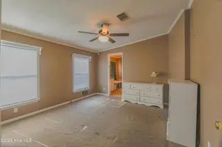 118 Woodland Drive, Swansboro, NC 28584 — 3-bedroom manufactured home in Hadnot Creek, Swansboro, NC, photo 7 of 16: Primary bedroom