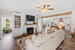 3997 Wyndmere Drive, Southport, NC 28461 – photo 11: Shiplap Accented Fireplace Wall