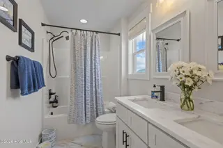 217 Coastline Circle, Cedar Point, NC 28584 – photo 22: Full bath with dual sinks