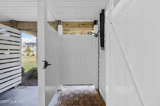 3617 W Pelican Drive, Oak Island, NC 28465 – photo 19: 14_outdoor shower