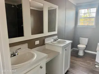 6850 Lewis Drive SE, Winnabow, NC 28479 – photo 6: Dual sinks in Master bath