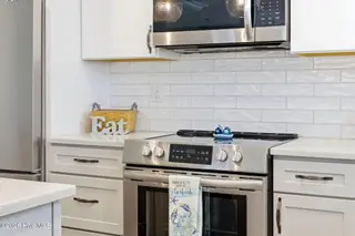 202 NE 64th Street, Oak Island, NC 28465 – photo 11: Quality stainless steel appliances