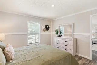 6745 Lewis Drive SE, Winnabow, NC 28479 – photo 17: Master bedroom