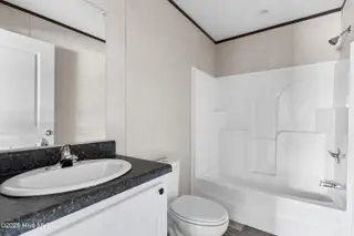 6795 Lewis Drive SE, Winnabow, NC 28479 – photo 23: Guest bathroom