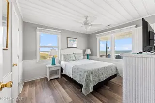 392 E First Street, Ocean Isle Beach, NC 28469 – photo 15: 1st of two ocean side primary bedrooms