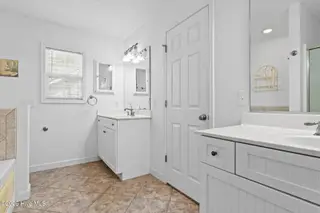 76 Calabash Drive, Calabash, NC 28467 – photo 17: Owners bathroom 2 vanities