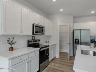 9454 Crowded Gules Drive Lot 217, Leland, NC 28451 – photo 12: TulipPolplar21303kitDRHL33A490-011-027-1