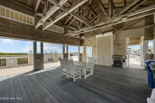 233 Sea Dreams Drive, Atlantic Beach, NC 28512 – photo 13: clubhouse shaded area near pool