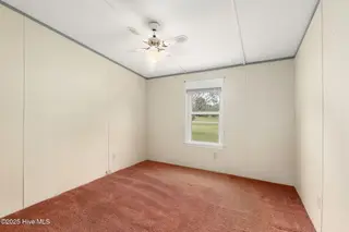 100 Lindsey Court, Beaufort, NC 28516 — 3-bedroom manufactured home in Green Meadows, Beaufort, NC, photo 10 of 38: Bedroom 2
