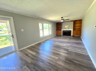 1018 Karen Drive, New Bern, NC 28562 – photo 2: 1018 Karen Front Room and fireplace