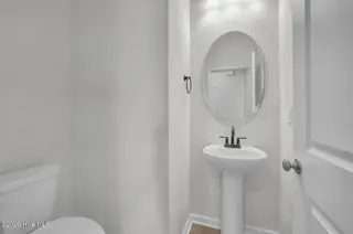 1210 Sunwater Terrace, Leland, NC 28451 — 3-bedroom townhome in Grand Park, Leland, NC, photo 13 of 46: Powder Room