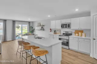 7111 Woodline Drive SW, Sunset Beach, NC 28468 – photo 19: Seaside Palms_Model_Venture_6911 Seaside