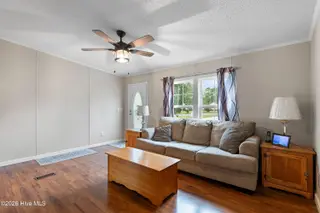 1109 Nautical Lane SW, Calabash, NC 28467 — 4-bedroom manufactured home in Village At Calabash, Calabash, NC, photo 5 of 34: Living room