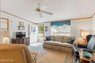 7203 Banner Street SW, Ocean Isle Beach, NC 28469 — 3-bedroom manufactured home in Seaside Heights, Ocean Isle Beach, NC, photo 8 of 38: Living Area