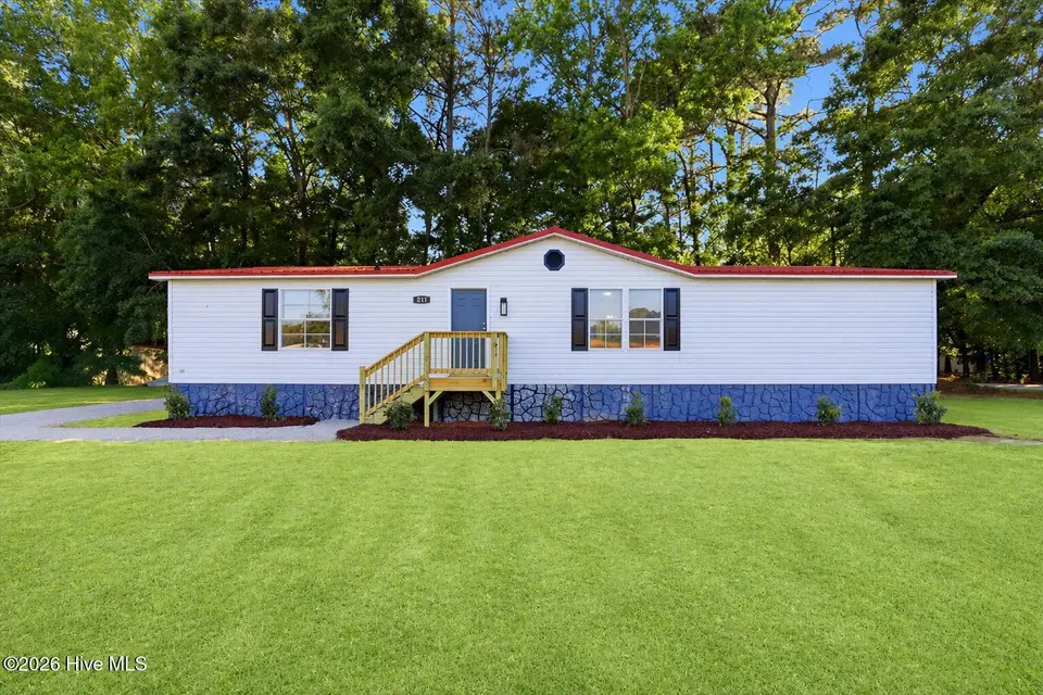211 Duck Ridge Drive, Pikeville, NC 27863 – photo 1 of 28: 211 Duck front