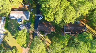 243 Ocean Forest Drive NW, Calabash, NC 28467 — 3-bedroom manufactured home in Ocean Forest, Calabash, NC, photo 18 of 61: DJI_20251101095439_0002_D