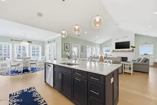 109 Ocean Bluff Drive, Indian Beach, NC 28512 – photo 18: Kitchen, Dining, and Living Room