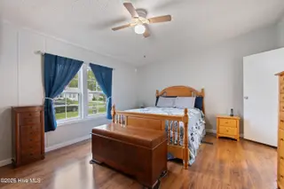 1109 Nautical Lane SW, Calabash, NC 28467 — 4-bedroom manufactured home in Village At Calabash, Calabash, NC, photo 16 of 34: Master bedroom