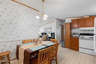 7203 Banner Street SW, Ocean Isle Beach, NC 28469 — 3-bedroom manufactured home in Seaside Heights, Ocean Isle Beach, NC, photo 12 of 38: Dining/Kitchen