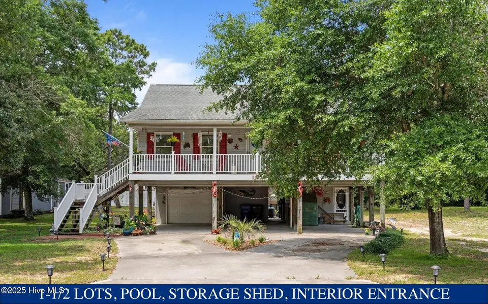 109 NE 1st Street, Oak Island, NC 28465 – photo 1 of 55: 109 NE 1st Street with owrding
