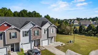 323 Cedar Island Trail, Holly Ridge, NC 28445 — 3-bedroom townhome in The Landing At Folkstone, Holly Ridge, NC, photo 2 of 36: 4_drone