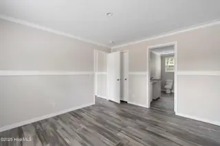 6777 Lewis Drive SE, Winnabow, NC 28479 – photo 13: Master bedroom