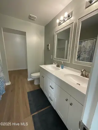 93 Shamrock Drive SW, Sunset Beach, NC 28468 – photo 9: Primary Bath with Double Sinks
