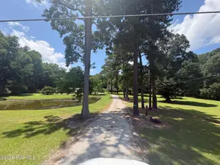 4396 James B White Highway S, Whiteville, NC 28472 – photo 2: Tree lined entrance