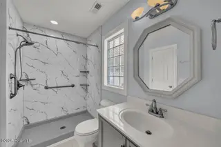 227 Gazebo Court, Wilmington, NC 28409 — 6-bedroom home in Inlet Point Harbor, Wilmington, NC, photo 13 of 67: First-Floor Bathroom