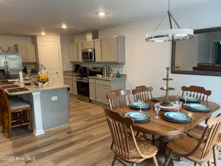 1439 New Sun Drive SE, Bolivia, NC 28422 — 4-bedroom home in Olde Georgetowne, Bolivia, NC, photo 8 of 15: 1439 kitchen & dining room
