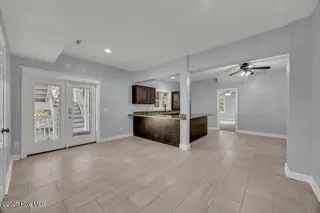 227 Gazebo Court, Wilmington, NC 28409 — 6-bedroom home in Inlet Point Harbor, Wilmington, NC, photo 8 of 67: First-Floor Great Room/In-Law Suite