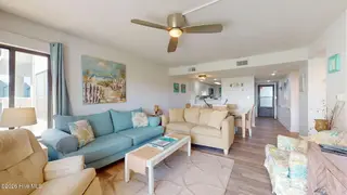 8801 Reed Drive 115, Emerald Isle, NC 28594 – photo 5: Large Living Room w/ Balcony Access