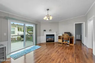 1109 Nautical Lane SW, Calabash, NC 28467 — 4-bedroom manufactured home in Village At Calabash, Calabash, NC, photo 14 of 34: Family room