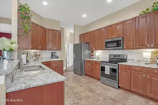1226 Atrium Way, Leland, NC 28451 — 3-bedroom home in Waterford of the Carolinas, Leland, NC, photo 5 of 61: Kitchen