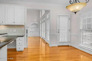 1119 Falling River Walk, Rocky Mount, NC 27804 — 4-bedroom home in River Falls, Rocky Mount, NC, photo 19 of 51: Hardwoods Flow Through Kitchen