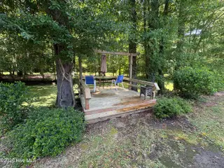 144 Waccamaw Shores Road, Lake Waccamaw, NC 28450 – photo 14: Deck Overlooking Canal