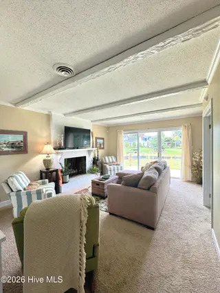 2128 Rivershore Road, Elizabeth City, NC 27909 — 3-bedroom home in Winslow Acres, Elizabeth City, NC, photo 12 of 48: Den to New Deck!