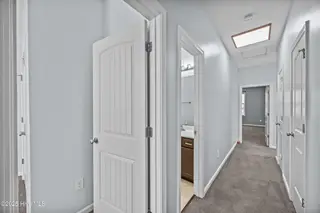 323 Cedar Island Trail, Holly Ridge, NC 28445 — 3-bedroom townhome in The Landing At Folkstone, Holly Ridge, NC, photo 20 of 36: 24_hallway