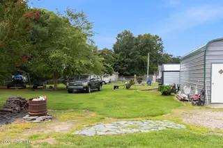 103 W Julian Avenue, Stantonsburg, NC 27883 – photo 2: 103 W. Julian Back yard 2