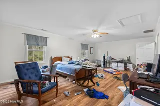 712 Page Drive, Jacksonville, NC 28540 — 4-bedroom home in Northwoods, Jacksonville, NC, photo 8 of 18: Primary Bedroom