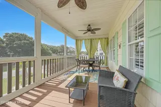409 Womble Street, Oak Island, NC 28465 – photo 6: Front Screen Porch