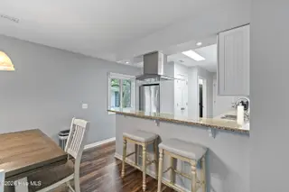 606 Camellia Lane, Sunset Beach, NC 28468 – photo 10: Dining to Kitchen