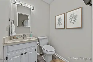 1928 New River Inlet Road 214, North Topsail Beach, NC 28460 – photo 10: Half Bathroom Staged