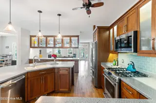 2790 Creek Bridge Court, Southport, NC 28461 — 3-bedroom home in St James, Southport, NC, photo 11 of 72: Cabinet Lighting | Gas Cooktop