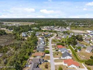 5014 N Hampton Drive SE, Southport, NC 28461 – photo 11: 11-web-or-mls-DJI_20260415124221_0403_D