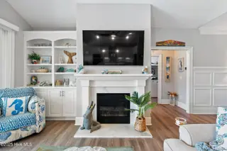 1353 Dunes Boulevard SW, Ocean Isle Beach, NC 28469 – photo 11: Gorgeous fireplace/built-in bookcases